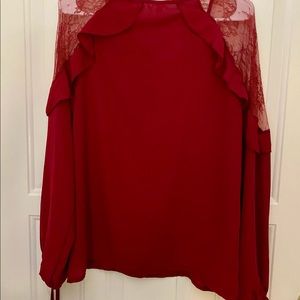 Nice and elegant blouse burgundy color, Size small.